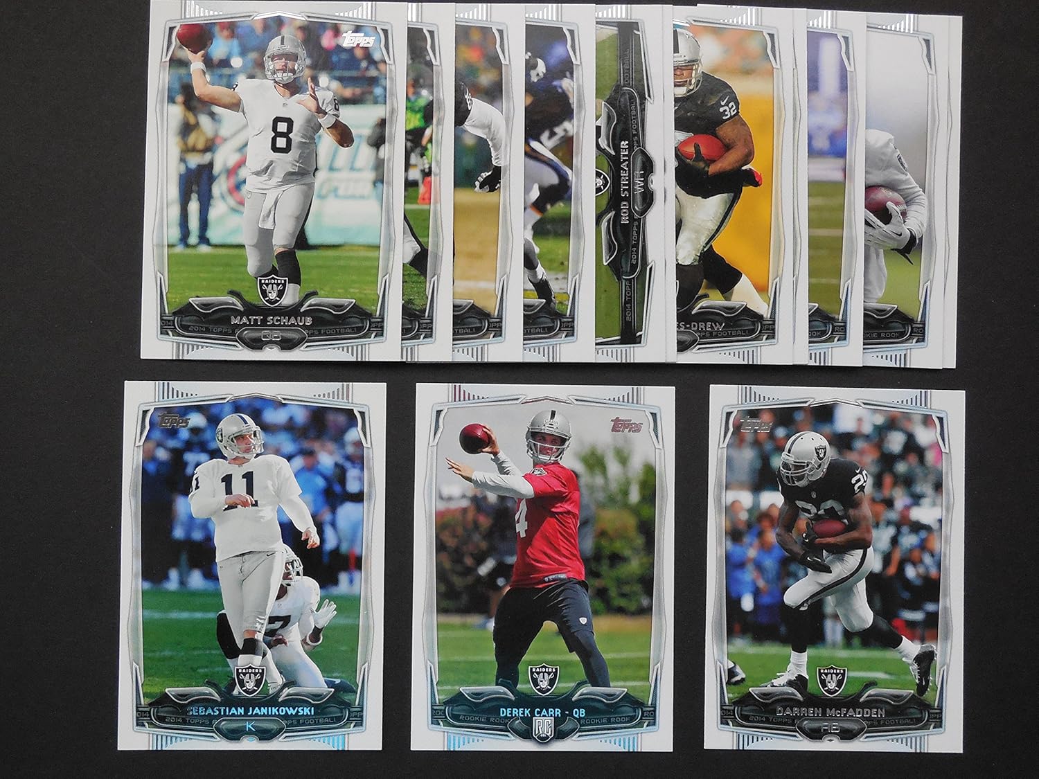 Oakland Raiders 2014 Topps Football Team Set (Includes Derek Carr Rookie Card)***Team Card, George Atkinson III, Derek Carr, Mike Davis, Sebastian Janikowski, James Jones, Maurice Jones-Drew, Khalil Mack, DArren McFadden, Matt McGloin, Denarius Moore, Matt Schaub, Rod Streater and Justin Tuck** (Los Angeles)