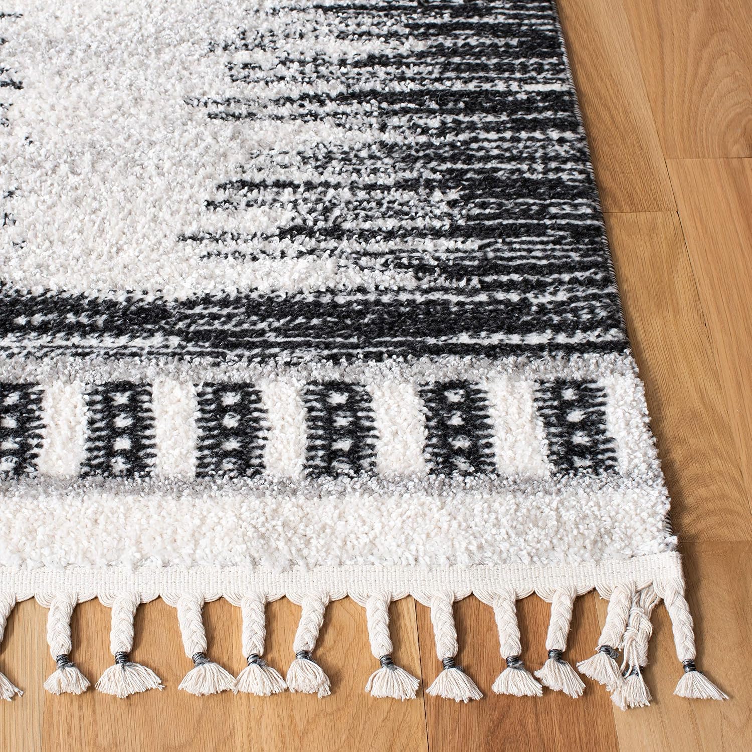 SAFAVIEH Moroccan Tassel Shag Collection Area Rug - 5'5" x 7'7", Ivory & Black, 0.75-inch Thick Ideal for High Traffic Areas in Living Room, Bedroom (MTS483A)