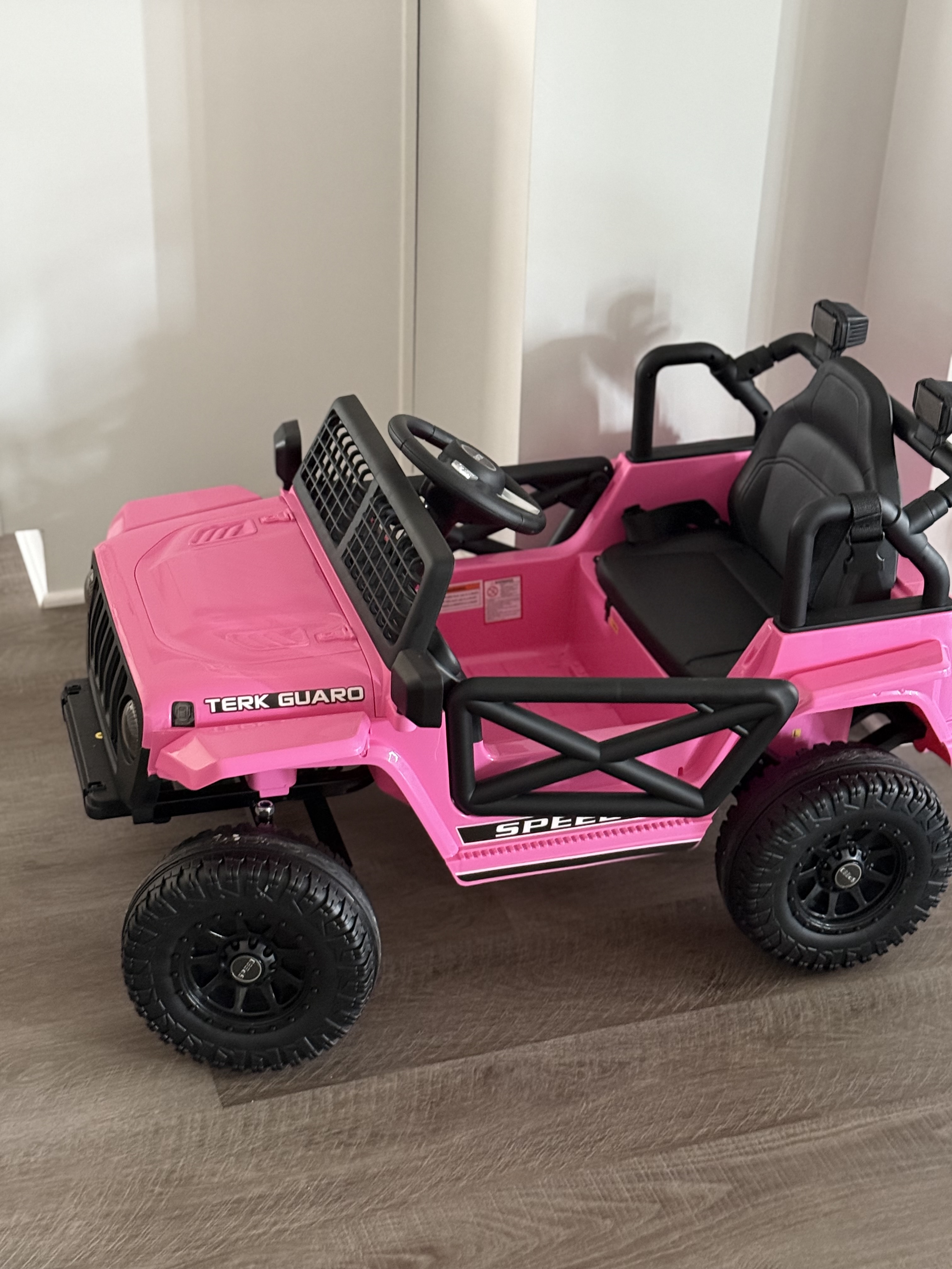 Parental remote control for the FUNTOK Electric Ride-On Truck, showing directional and speed buttons.