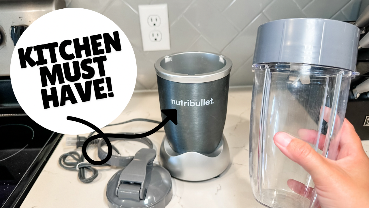 NutriBullet Pro 900-Watt Blender setup showing cup with blade attached being placed on motor base