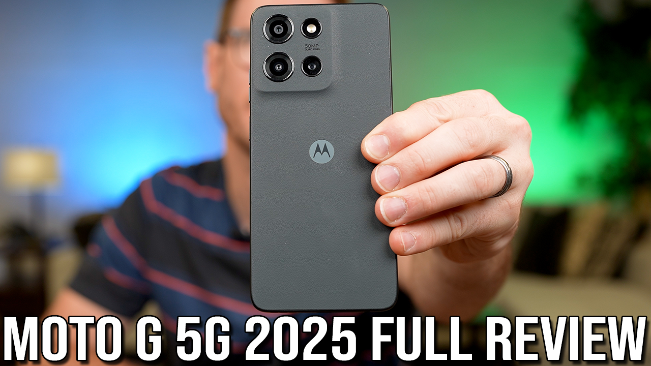 Hand holding the OEJBK I25 Ultra displaying a vibrant landscape on its 6.99-inch HD screen