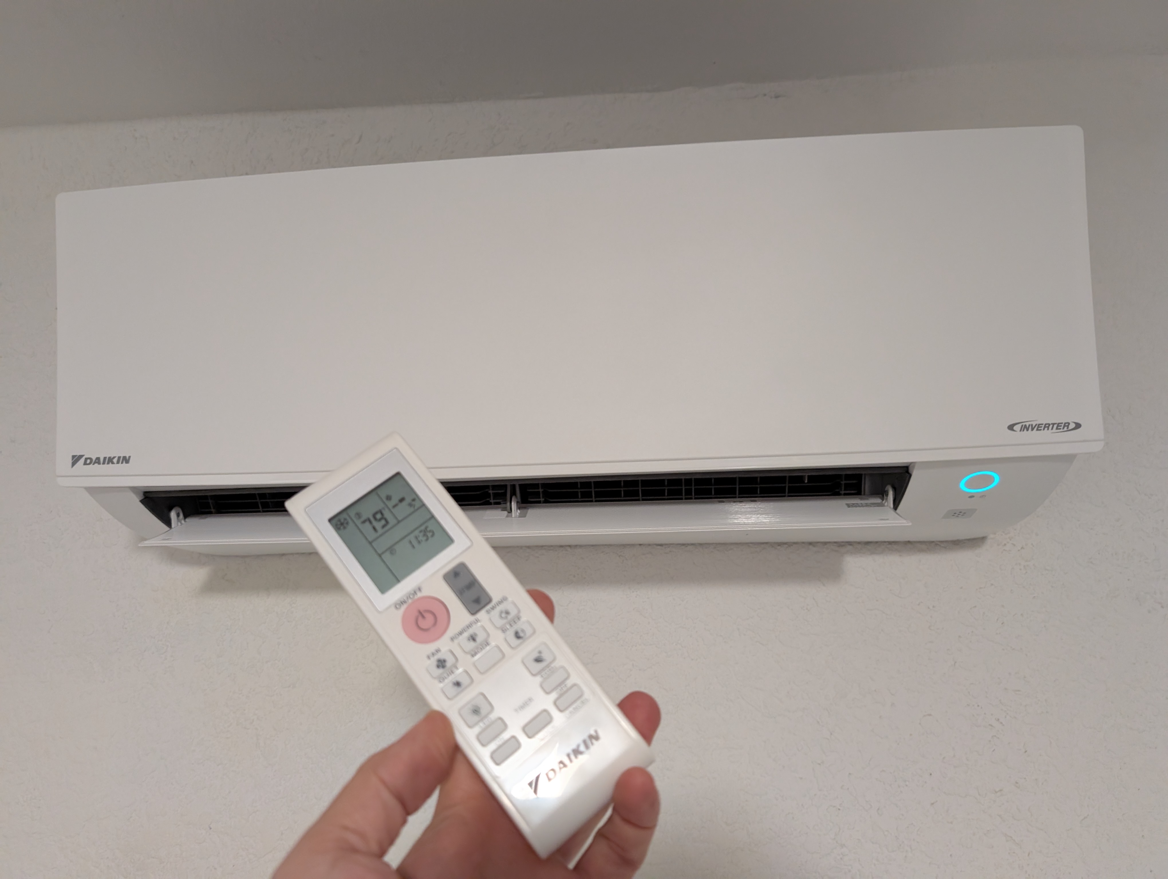 Daikin outdoor mini split unit mounted on an exterior wall