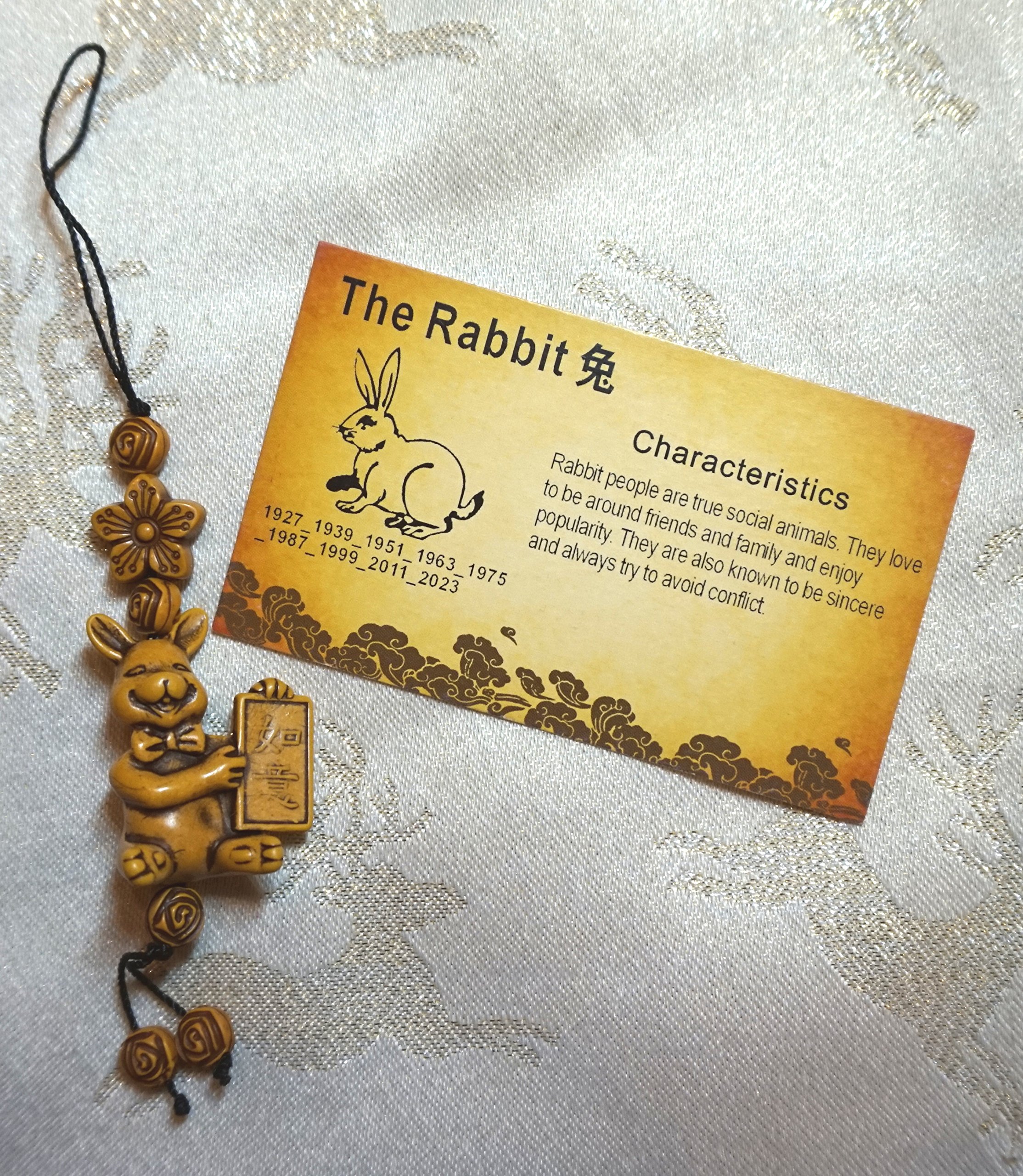 CHINESE NEW YEAR LUCKY RABBIT FENG SHUI CHARM WITH BEADED CORD AND CHARACTERISTIC CARD