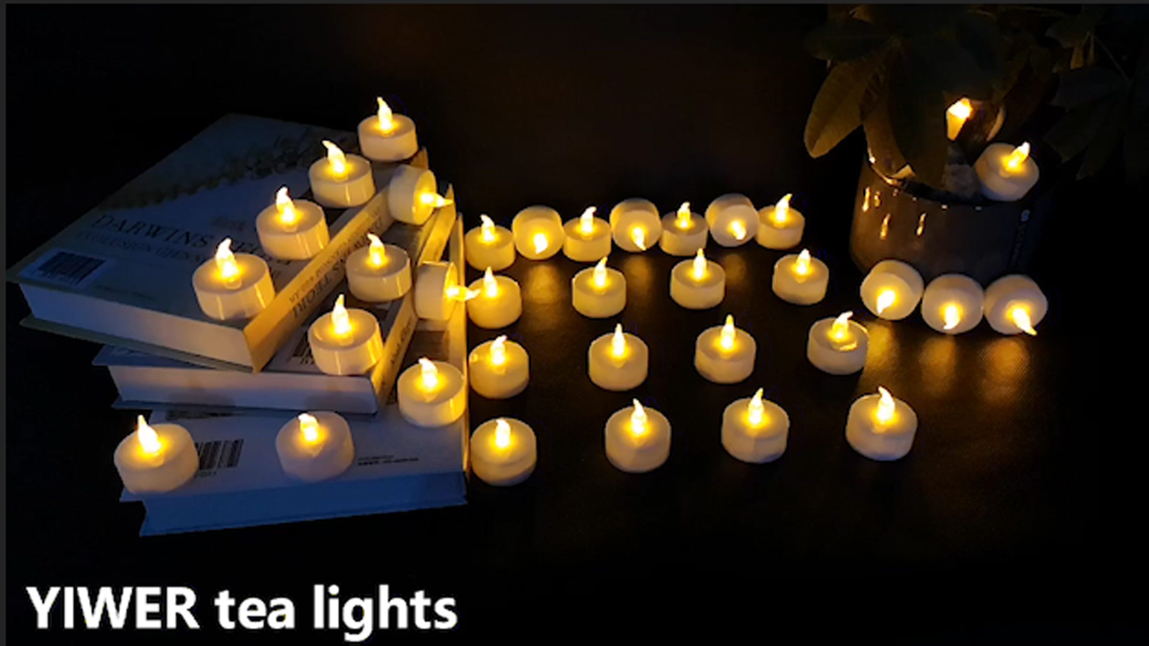Image of YIWER Battery Tea Lights Candles Set of 24: Flickering flameless Realistic Tealights with Warm Yellow Light Candle Light for Festivals Parties Halloween Warm Atmosphere (Pack of 3)