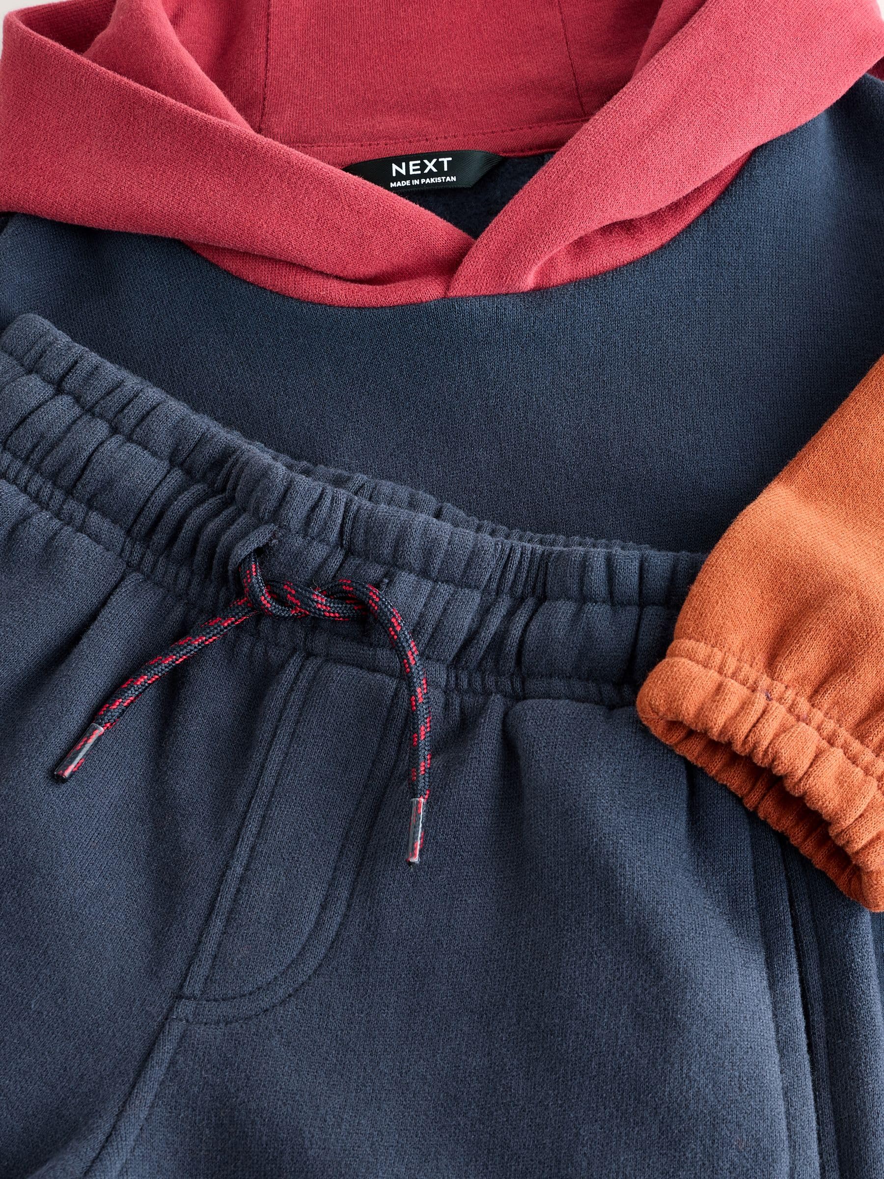 NEXT Niños Conjunto de sudadera con capucha y pantalón de chándal en bloques de color