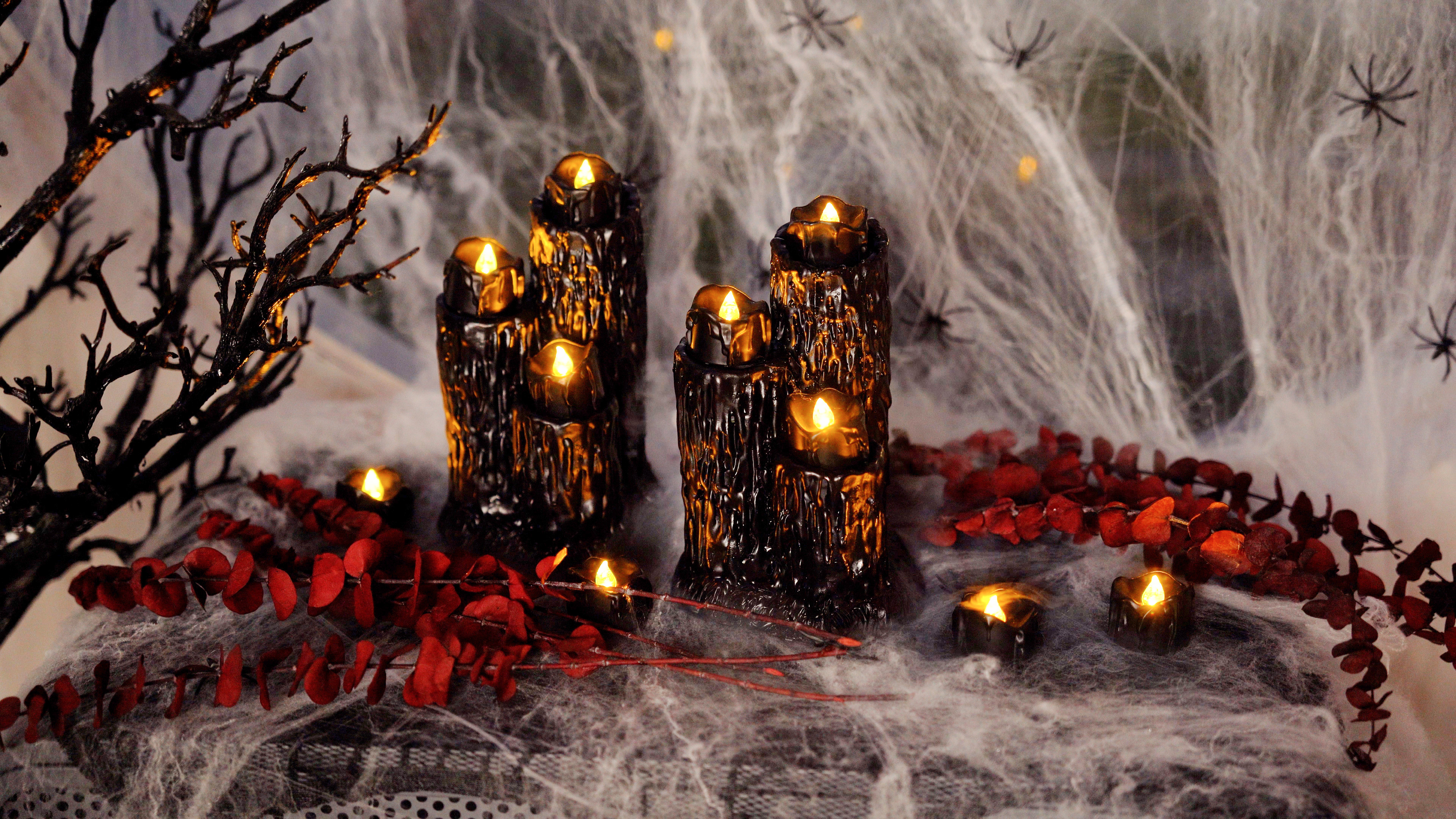 Image of Homemory 24-Pack Halloween Black Dripping Flameless Tea Lights, Battery Operated Flickering LED Candles, Safe for Pumpkins, Party & Holiday Decor, 1.58 inch D x 1.2 inch H, Warm White Glow