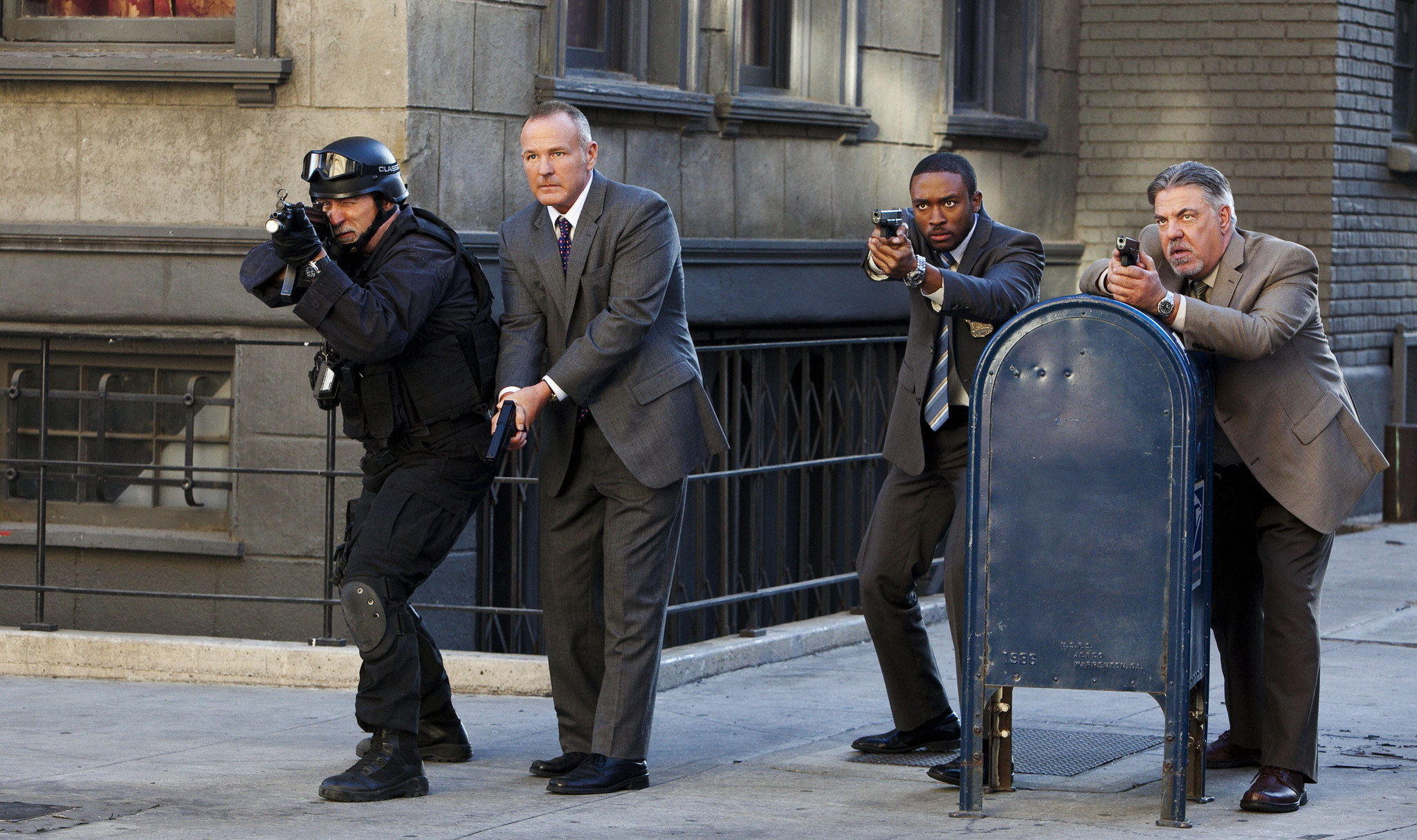 Brian Goodman, Bruce McGill, Lee Thompson Young, and Russ Grant in Rizzoli & Isles (2010)