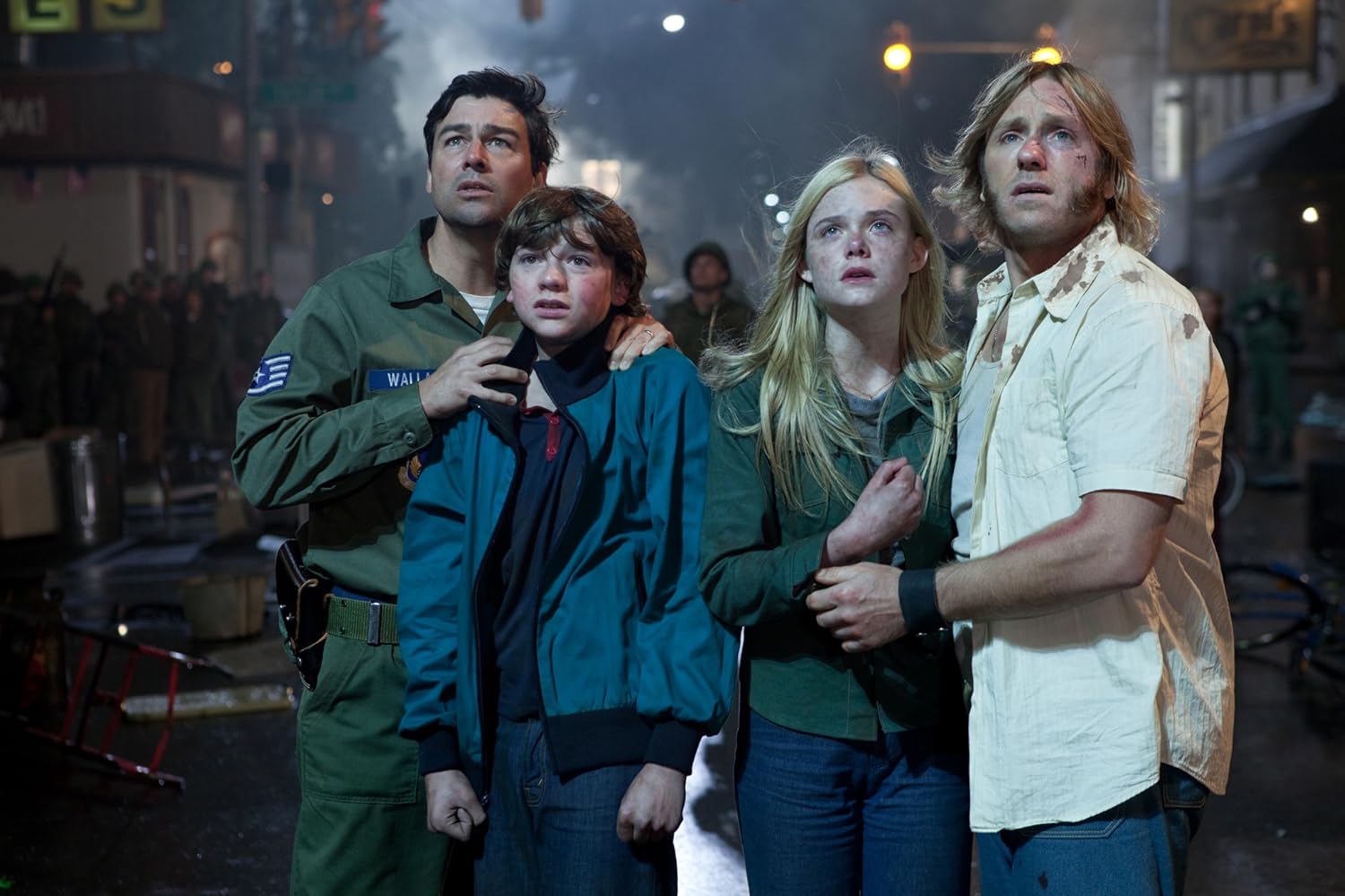 Kyle Chandler, Ron Eldard, Elle Fanning, and Joel Courtney in Super 8 (2011)