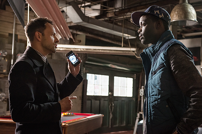 Jonny Lee Miller and Ato Essandoh in Elementary (2012)