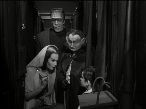 Yvonne De Carlo, Fred Gwynne, Al Lewis, and Butch Patrick in The Munsters (1964)