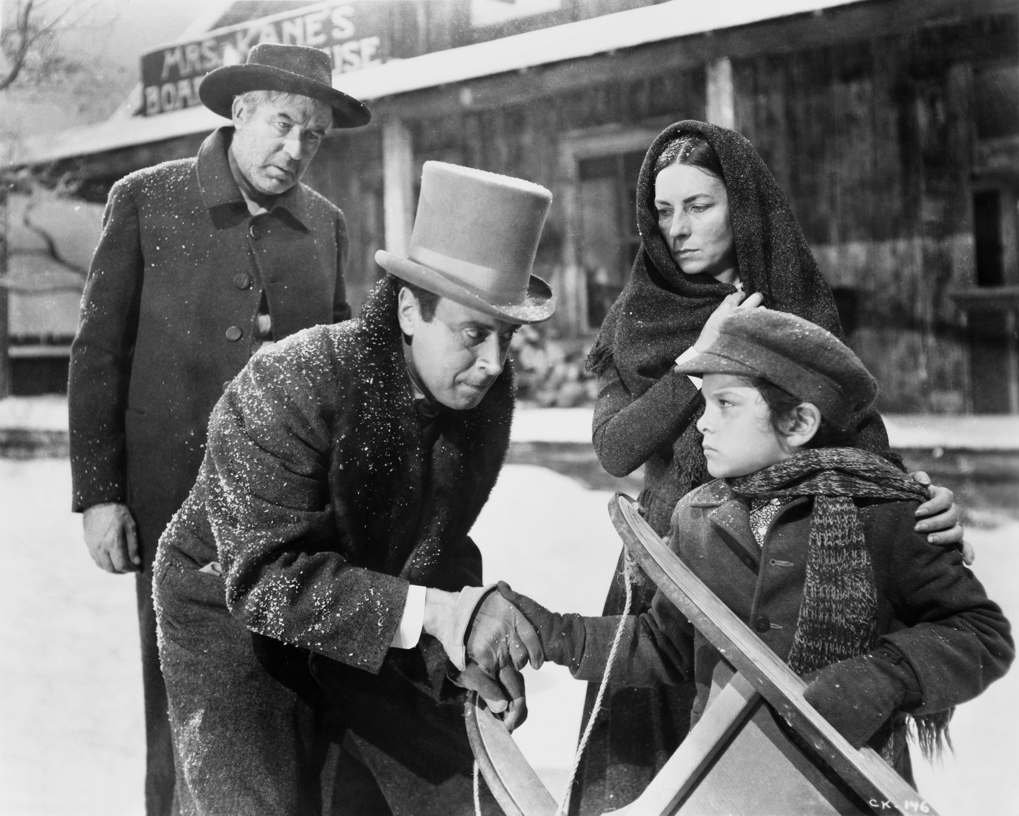 Agnes Moorehead, George Coulouris, Harry Shannon, and Buddy Swan in Citizen Kane (1941)