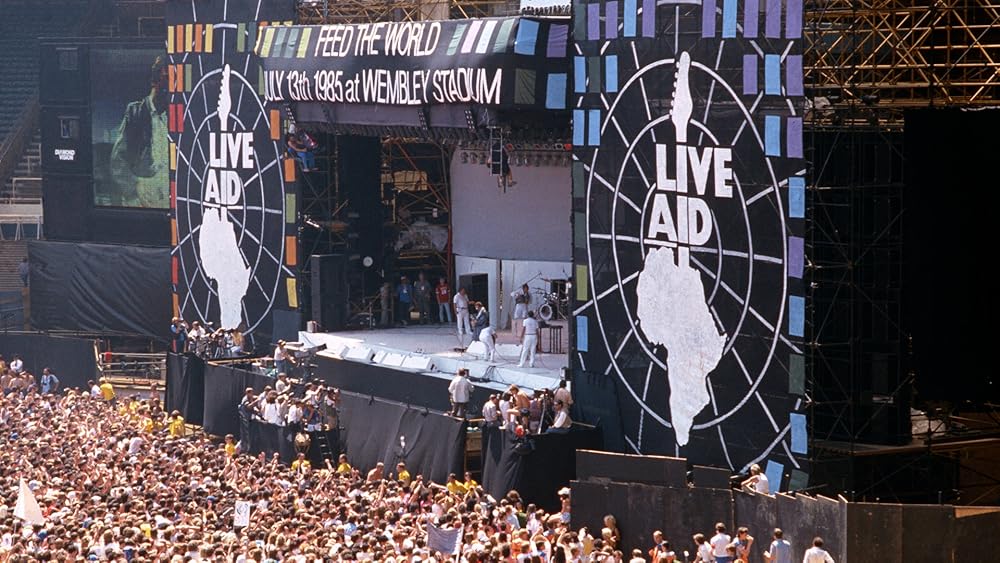 Концерт aid 1985. 13 июля 1985 концерт live aid. Live aid 1985 пол маккартни. Концерт группы queen в 1985 году. Концерт aid 1985.