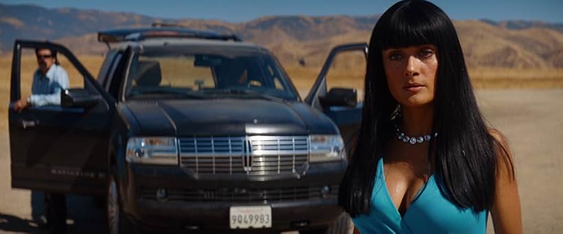 Salma Hayek and Benicio Del Toro in Savages (2012)