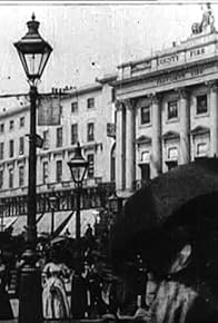 Primary photo for Leisurely Pedestrians, Open Topped Buses and Hansom Cabs with Trotting Horses