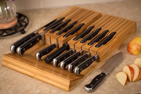 A bamboo in-drawer knife organizer