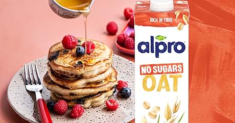 Alpro oat drink advertisement featuring stack of pancakes with berries and text 'YOU SAY NO TO SUGARS. WE GOT YOU.' with product package.