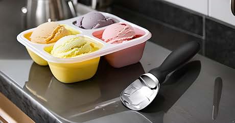 Tray with four compartments containing different colored ice cream scoops. Yellow, pink, and white flavors visible. Metal scoop on the side.