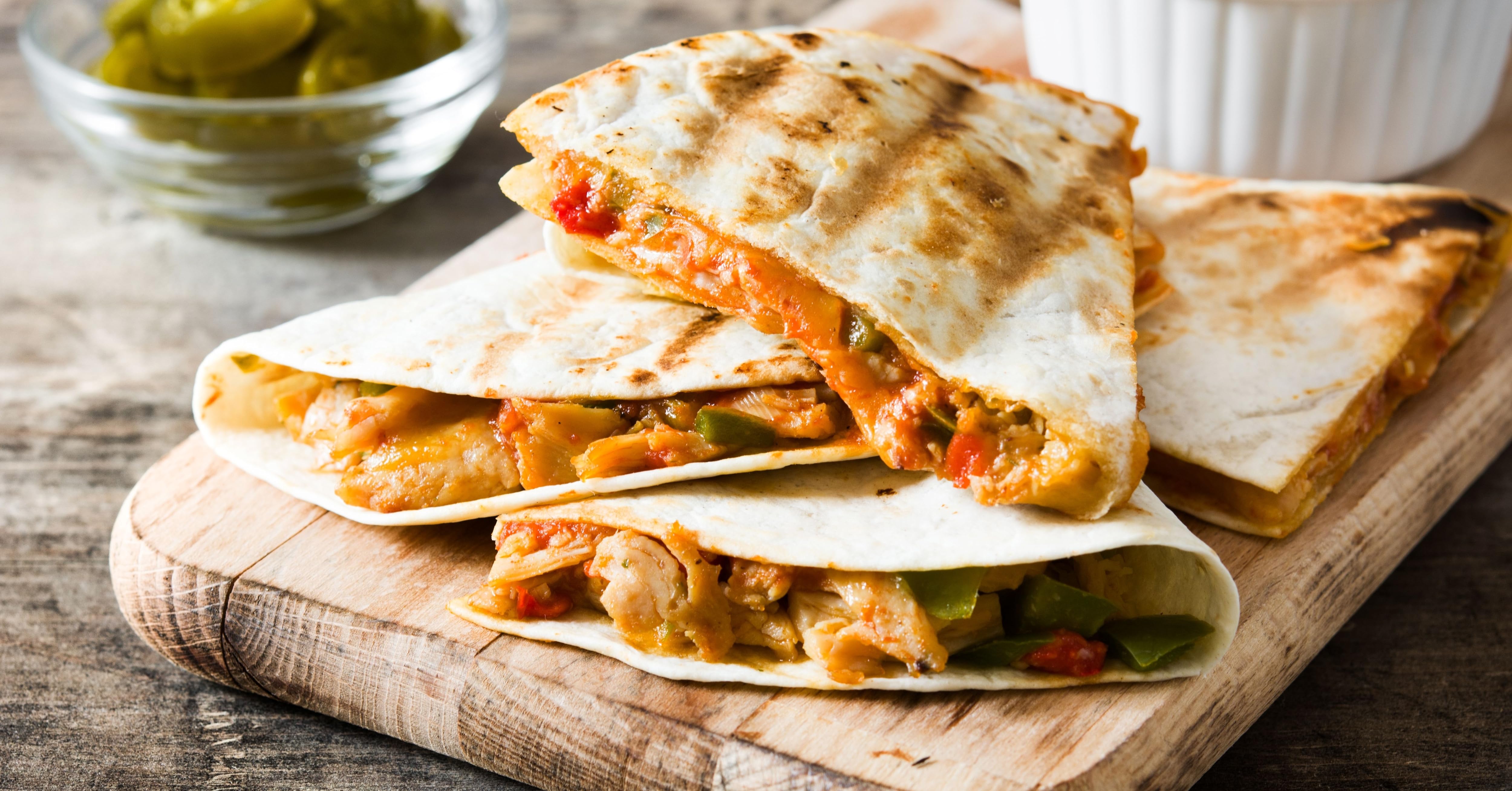 chicken quesadillas on a wooden board