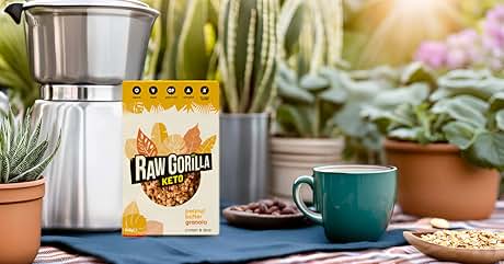 Coffee table scene with stainless steel French press, coffee mug, and Raw Gorilla cereal box surrounded by potted plants.