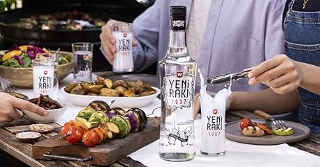 a bottle of yakuza gin next to a plate of vegetables