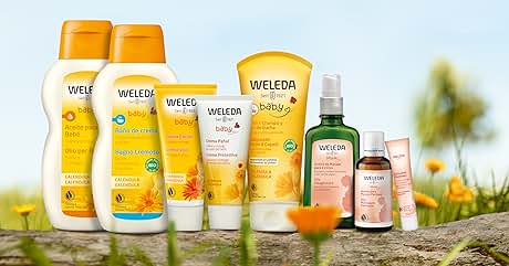 de productos para el cuidado corporal de Weleda, que incluye lociones, cremas y aceites en varios tamaños. Botellas amarillas y naranjas con el telón de fondo de la naturaleza