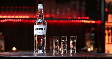 a bottle of moka gin and shot glasses