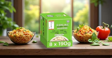 Text reads "KONJAC NOODLES 8 x 190g". Green product box of konjac noodles on wooden surface. Two glass bowls with prepared noodles, red tomato, and herbs flanking the box.