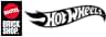 dice «MATTEL BRICK SHOP». Logotipo rectangular negro con elemento circular rojo que contiene texto blanco de Mattel. Abajo, en texto blanco sobre fondo negro: BRICK SHOP
