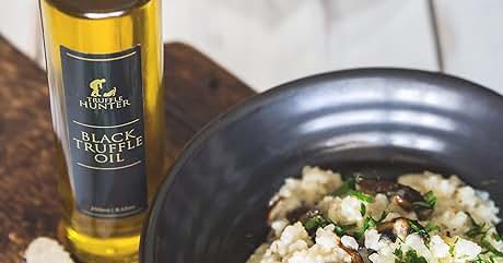 a bowl of risotto with a bottle of wine and a bottle of wine