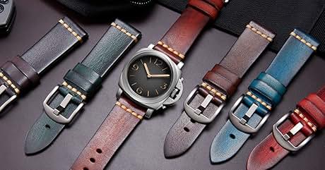 con esfera negra y caja de acero, rodeado de cinco correas de piel en varios colores, incluidos negro, verde, rojo, marrón y azul