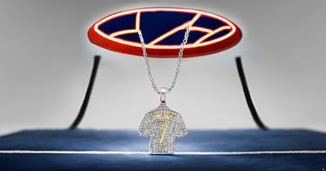 Crystal-encrusted jersey-shaped pendant necklace on silver chain, displayed against red and blue geometric background