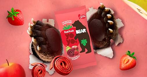 Promotional image for BEAR Yo Yo fruit snacks. Shows red packaging with strawberry flavor, surrounded by strawberries, apple slices, and rolled fruit strips resembling paw prints.