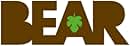 Wooden wall decoration spelling 'BEAR' in large block letters. Small green shamrock shape integrated into letter 'A'.