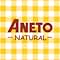 Etiqueta de producto para «Aneto Natural» sobre fondo amarillo y blanco a cuadros, que sugiere un producto alimenticio