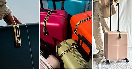 Collection of hard-shell rolling suitcases in various colors including pink, orange, turquoise and yellow, with black straps and handle details.