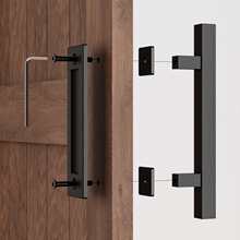 Zwei schwarze Scheunentürgriffe aus Metall, nebeneinander abgebildet. Rechteckige Form mit geraden Kanten. Sichtbare Montageteile für die Montage an Holztüren.