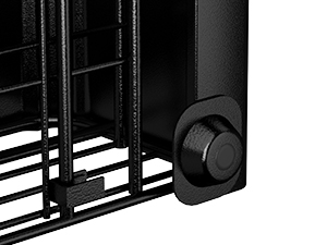 Close-up detail of a black metal appliance showing an adjustment knob or control dial mounted on a grated or slatted surface.