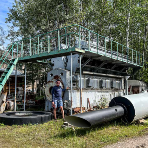 Tom Cotter near a giant engine