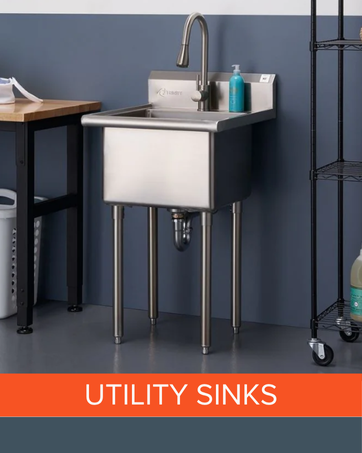 Stainless steel utility sink with tall faucet in a workshop or laundry setting