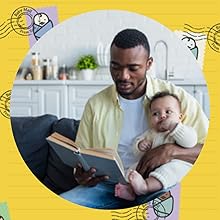 A new dad reading the journal dads letters to baby to his new baby
