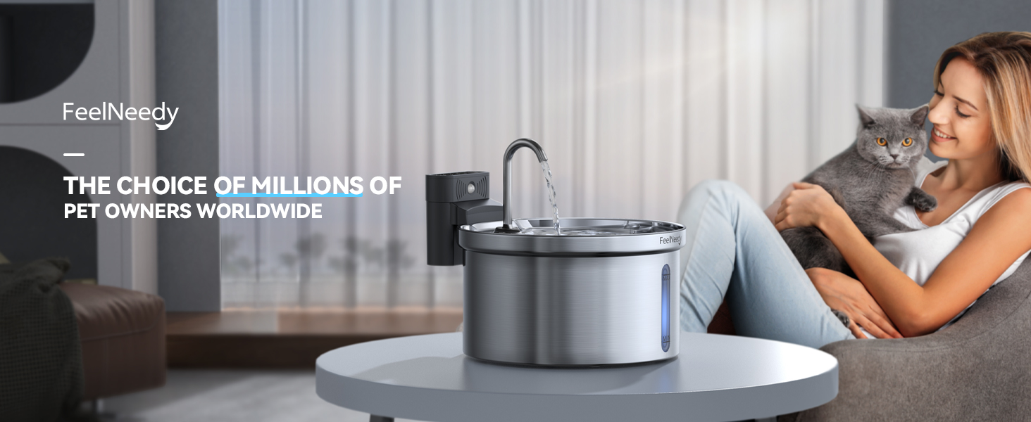 Stainless steel pet water fountain on side table with multiple filtration levels. FeelNeedy brand product shown in modern home setting.