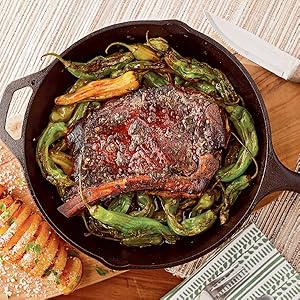 Cast iron pan with peppers and steak. 