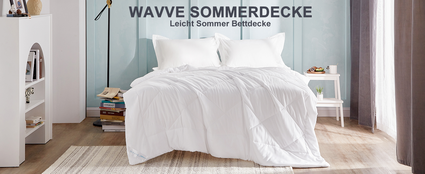 a bed with a white comforter and white sheets.