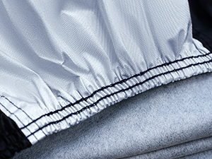 Close-up views of light gray fabric or textile material with visible stitching or seams, shown from multiple angles.