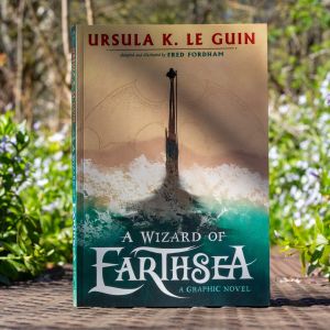 The Wizard of Earthsea against a background of flowers