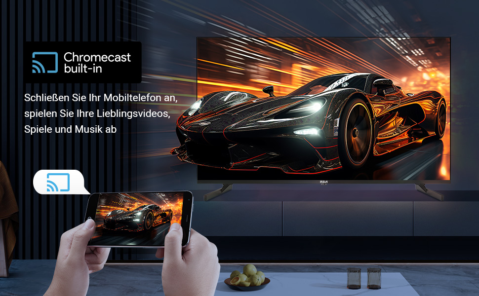 Smart TV displaying a high-speed sports car image. A hand holds a smartphone mirroring the TV content, demonstrating Chromecast built-in feature.