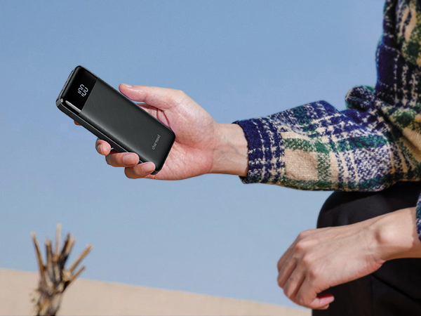 a person holding a smartphone in their hand.