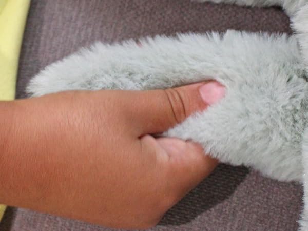 Image of kid playing with the marble inside the turtles tail.