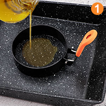 Wash and dry the pan, place the egg rings on top