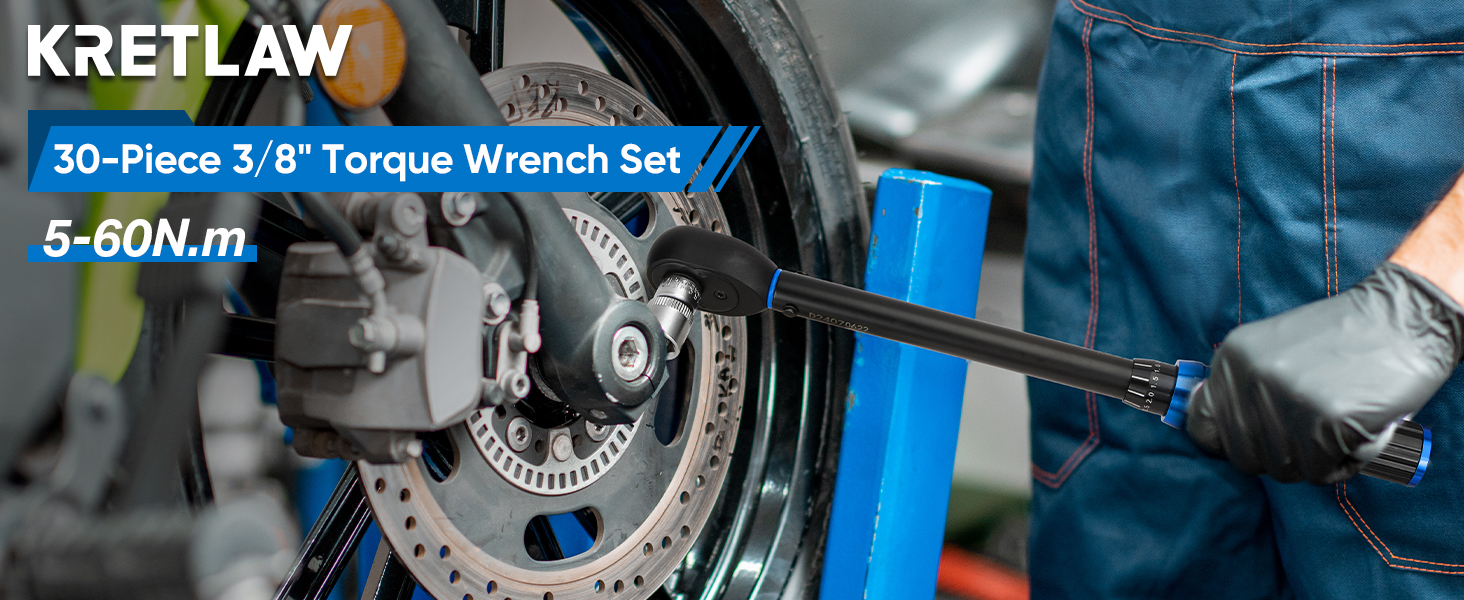 Torque wrench being used on motorcycle wheel. Blue tool with 'KRETLAW' branding visible. Text indicates '30-Piece 3/8